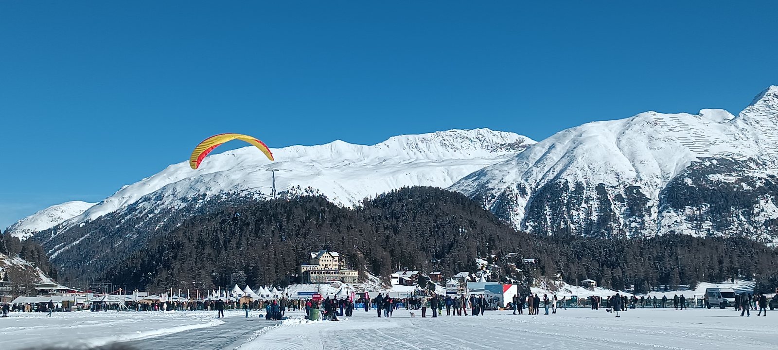 St. Moritz lakeside signpost and mountains